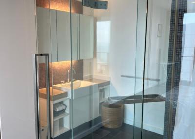 Modern bathroom with glass shower enclosure and sleek design