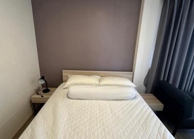 Cozy bedroom with white bedding and neutral color palette