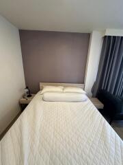 Cozy bedroom with white bedding and neutral color palette