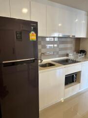 Modern kitchen with stainless steel appliances and white cabinetry