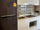 Modern kitchen with stainless steel appliances and white cabinetry