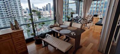 Modern living room with floor-to-ceiling windows and cityscape view