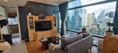 Modern living room with city view through large window