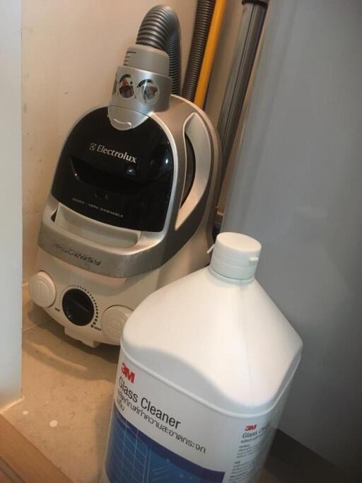 Vacuum cleaner and cleaning supplies in a storage space