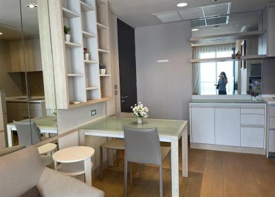 Modern kitchen with dining area and wooden floor