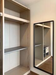 Modern Bedroom with Built-in Wardrobe and Full-Length Mirror