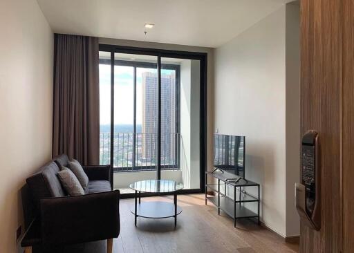 Modern living room with large windows and city view