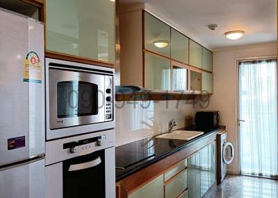Modern kitchen with ample cabinets and built-in appliances