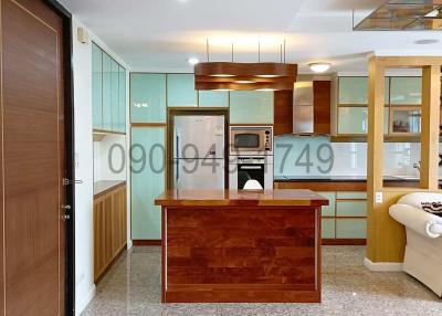 Modern spacious kitchen with wooden cabinets and granite countertops