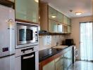 Modern kitchen with stainless steel appliances and ample cabinet space