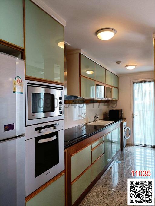 Modern kitchen with stainless steel appliances and ample cabinet space