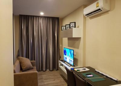 Cozy and modern living room interior with comfortable furnishings and entertainment unit