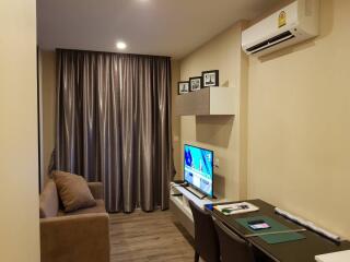 Cozy and modern living room interior with comfortable furnishings and entertainment unit