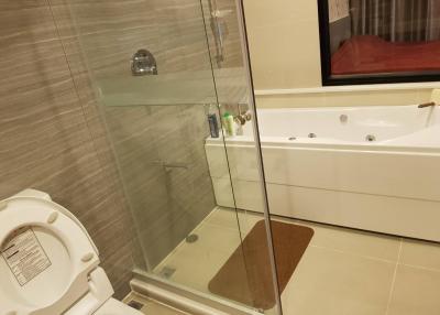 Spacious modern bathroom with shower and bathtub
