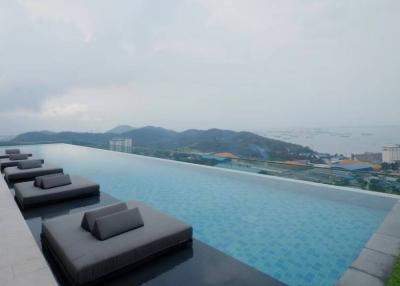 Luxury infinity pool with sea and mountain views