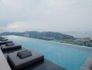 Luxury infinity pool with sea and mountain views