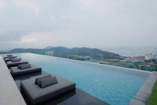 Luxury infinity pool with sea and mountain views