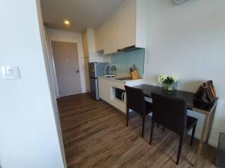 Modern kitchen with dining area and wooden flooring