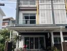 Modern townhouse exterior with balcony and garage