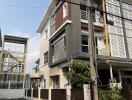 Modern suburban house with a balcony and gated entrance