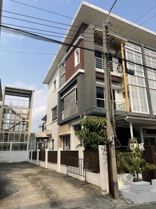 Modern suburban house with a balcony and gated entrance