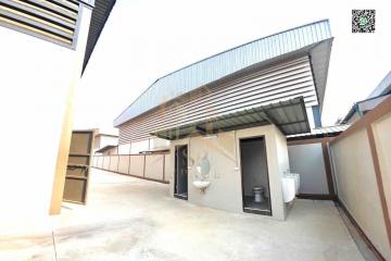 Exterior view of a modern building with partial view of bathroom facilities