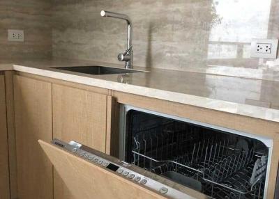 Modern kitchen with wooden cabinets and built-in dishwasher