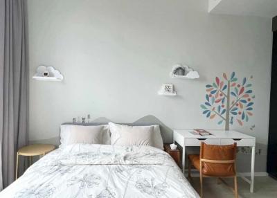 Cozy bedroom with artistic wall decorations and modern furniture