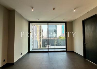 Spacious unfurnished apartment interior with large windows and city view