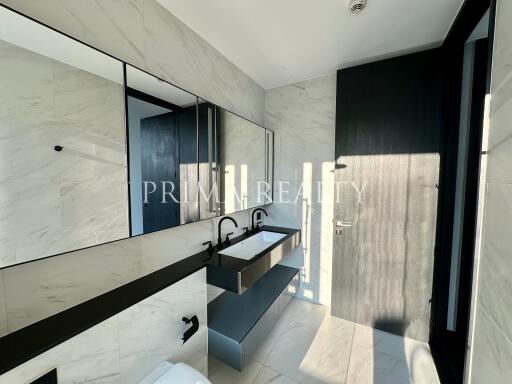 Modern bathroom with natural light and marble tiles