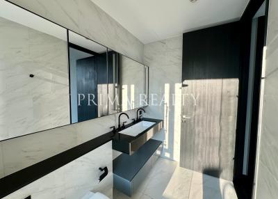 Modern bathroom with natural light and marble tiles