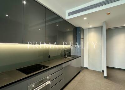 Modern kitchen with integrated appliances and LED under-cabinet lighting