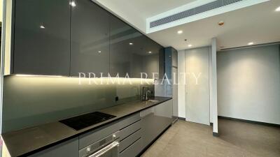 Modern kitchen with integrated appliances and LED under-cabinet lighting