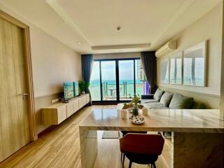 Cozy living room with sea view, natural light, and modern furniture