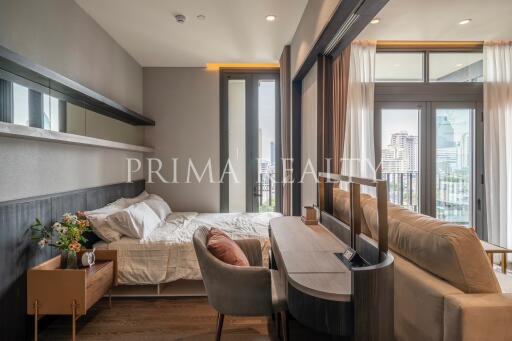 Modern bedroom with city view and comfortable furnishings