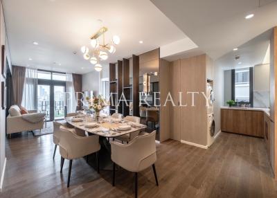 Modern open plan living space with dining area and kitchen