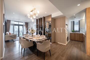 Modern open plan living space with dining area and kitchen