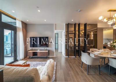 Modern living room with dining area and city view