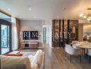 Modern living room with dining area and city view