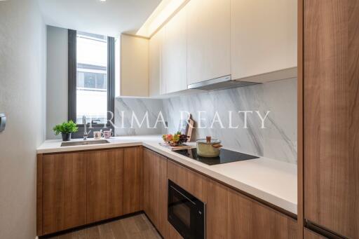 Modern kitchen with wooden cabinets and marble countertops