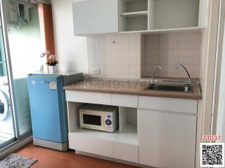 Compact kitchen corner with appliances and cabinet space