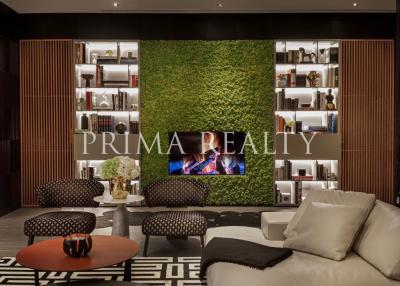 Modern living room interior with a vertical garden and cozy seating arrangement
