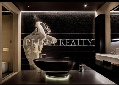 Modern bathroom with artistic stone basin and sophisticated lighting