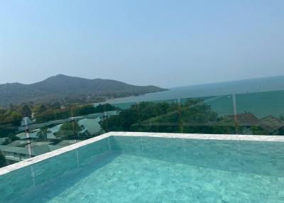 Infinity pool with panoramic sea and mountain views