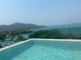 Infinity pool with panoramic sea and mountain views