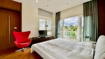 Bright bedroom with a modern design and scenic view