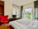 Bright bedroom with a modern design and scenic view