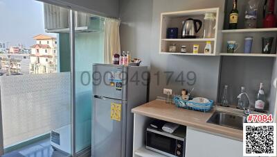 Modern kitchen with appliances and balcony view