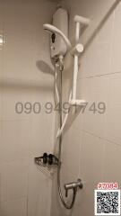 Electric shower unit with white wall tiles in bathroom