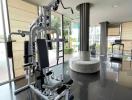 Modern private gym inside residential building with exercise equipment